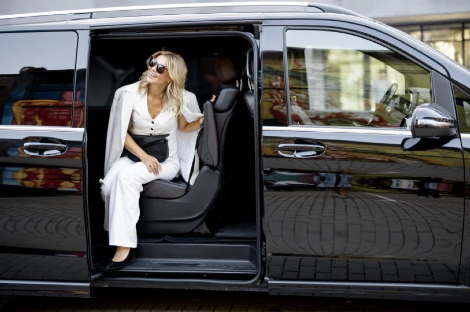 A guest travelling in a private executive vehicle
